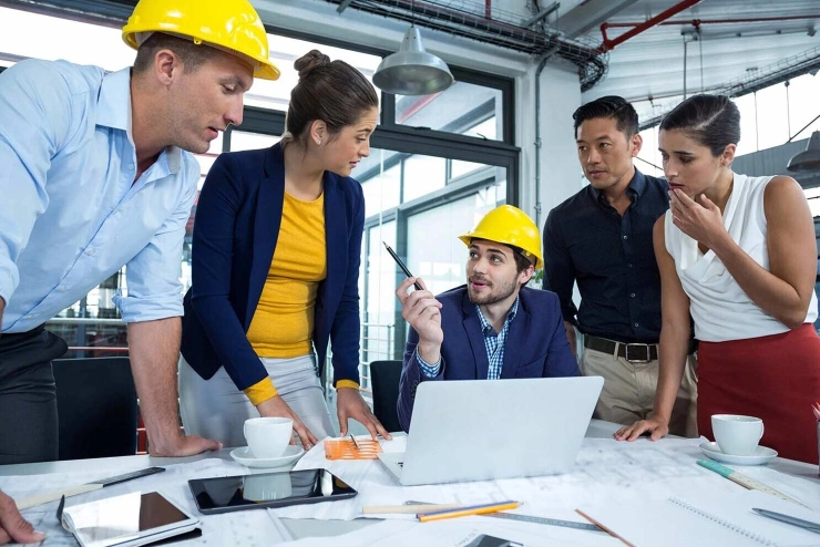 Construction workers coordinating on site
